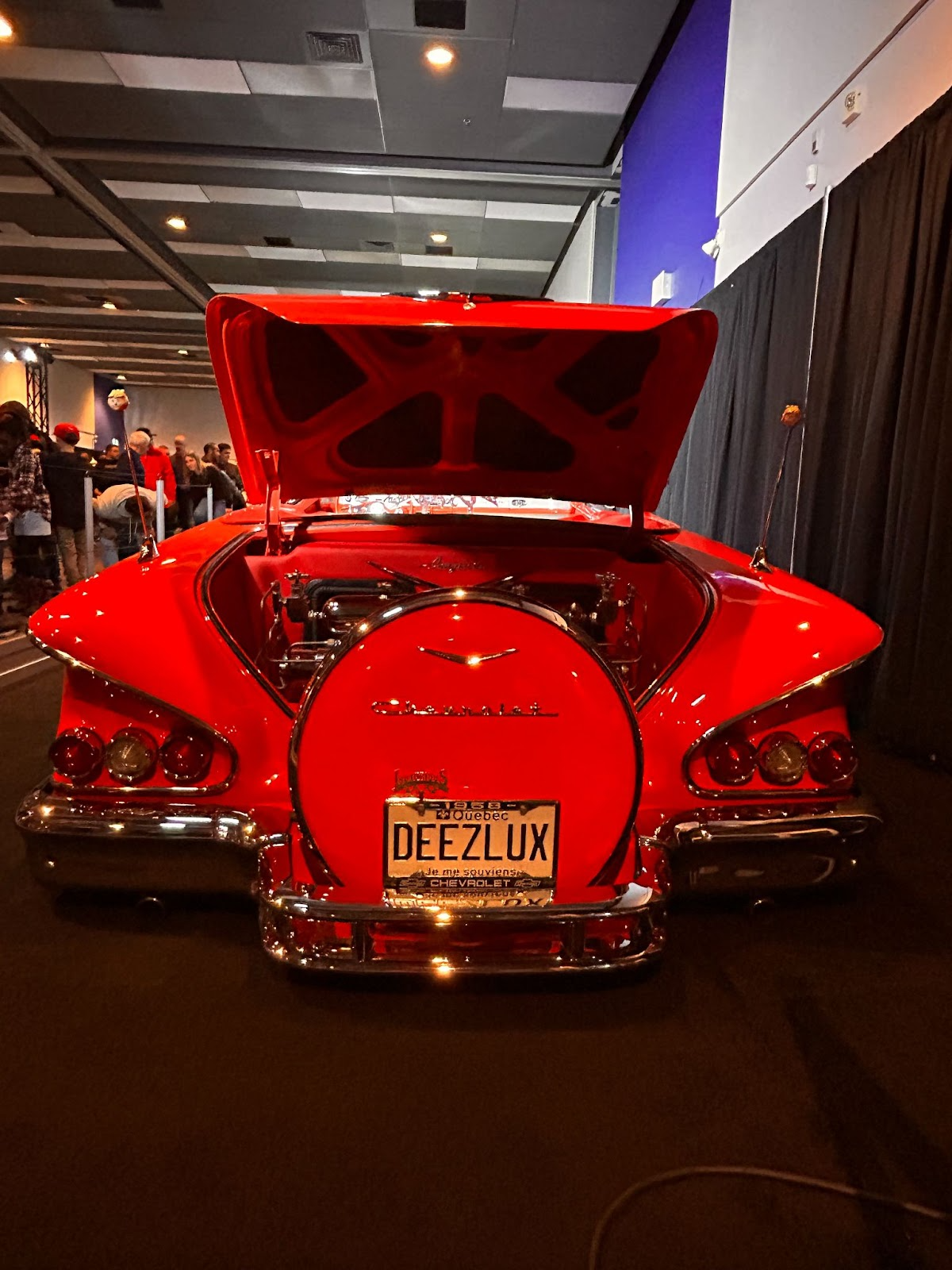 Picture of Chevy Impala's backside, it is bright red